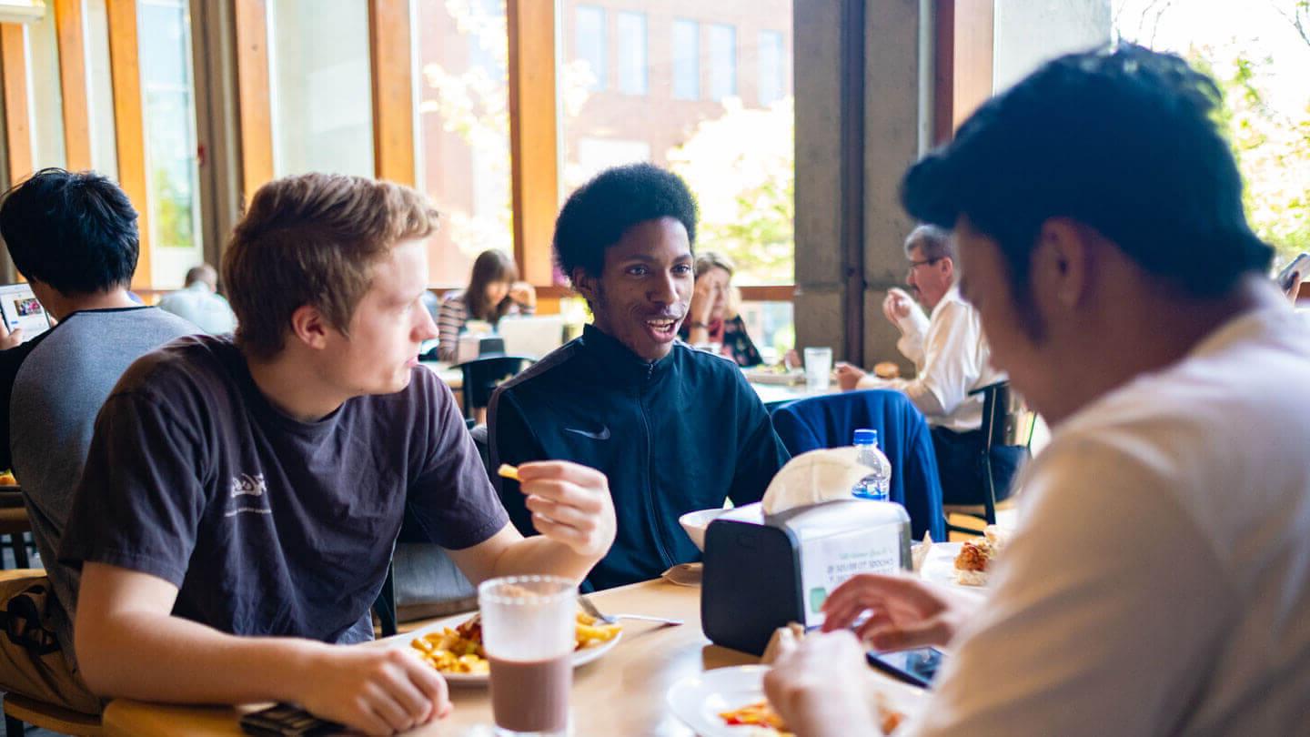male students dine at gwinn commons